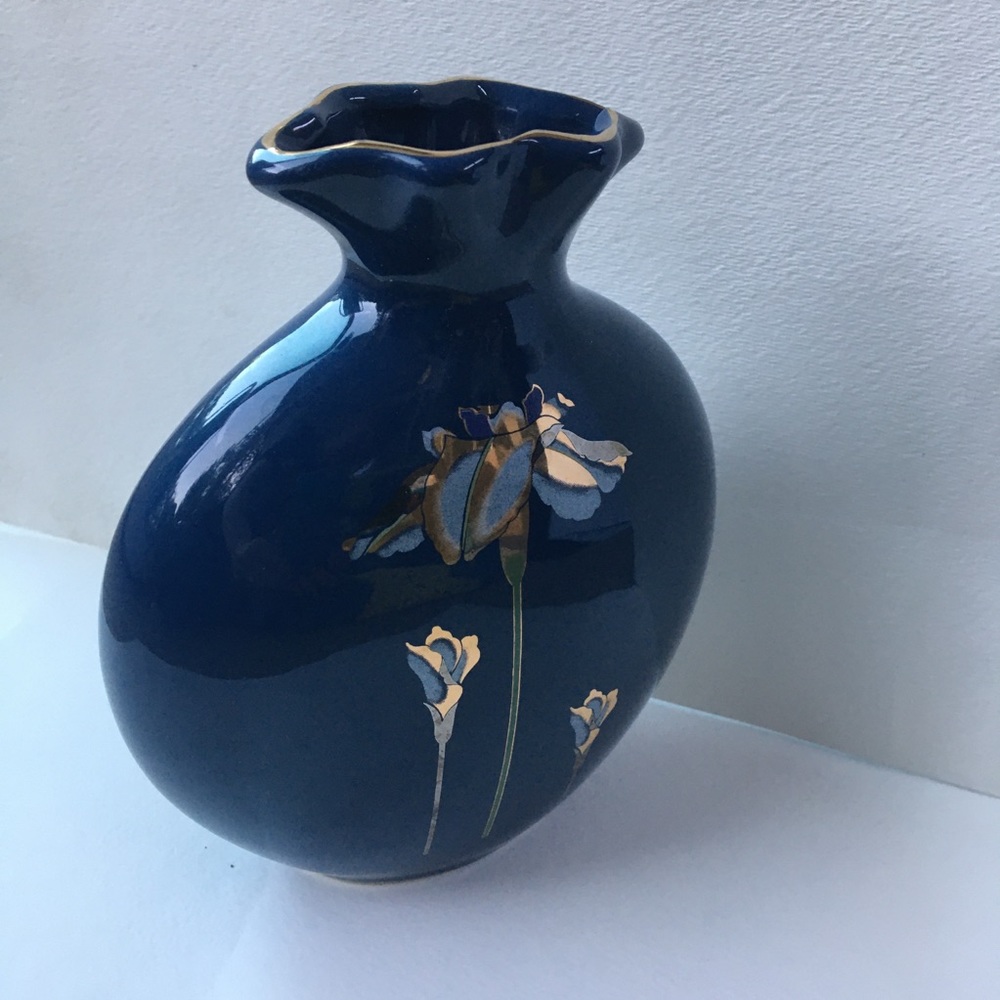 Deep blue bud vase with artistic floral design